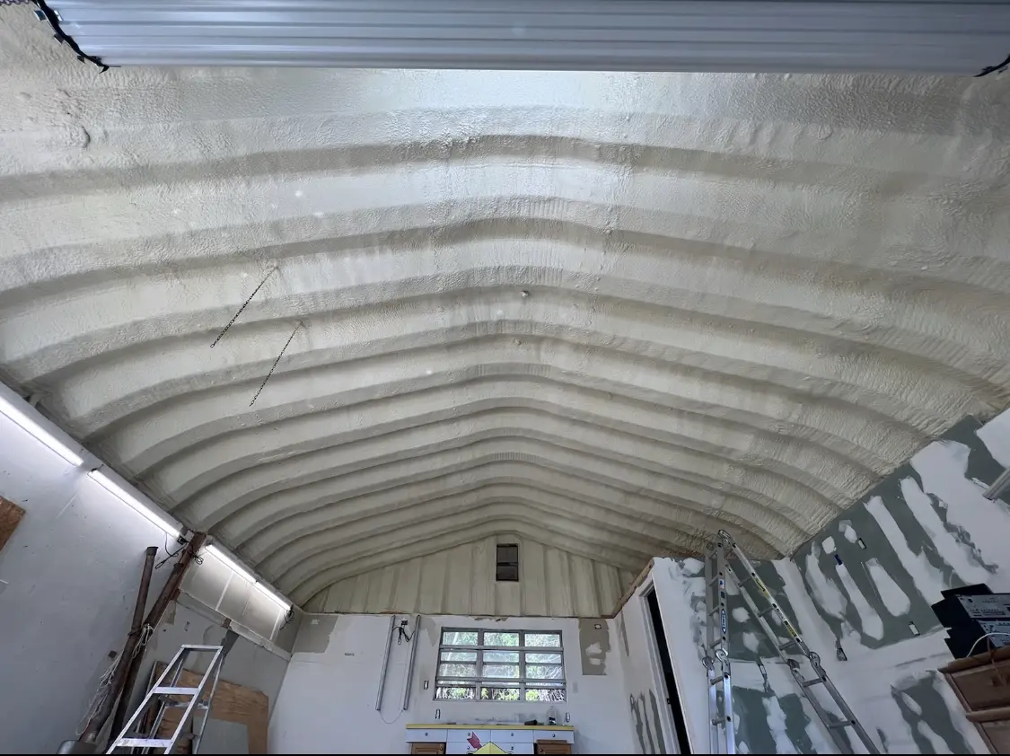 Spray polyurethane foam applied to the underside of a metal roof deck in Grove City